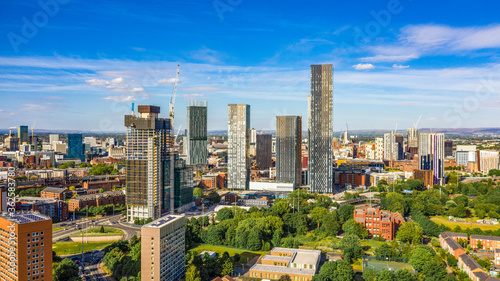 Fotografie, Obraz Aerial shot of Manchester UK on a beautiful summer day during pandemic lock-down