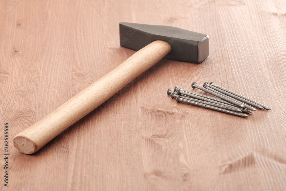 nails and hammer are new carpenter's tools nails and hammer are new carpenter's tools