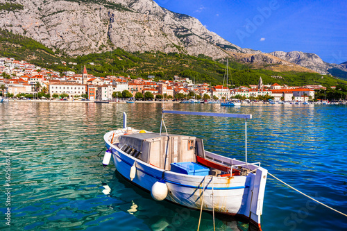 Fototapeta Naklejka Na Ścianę i Meble -  Croatia summer holidays - famous Adriatic coast - Makarska riviera in Dalmatia. Charming marine with fishing boats.