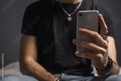 young man texting on mobile phone