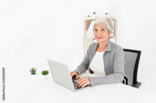 old asian woman learning to use laptop, she search information with internet technology, brain training with education online, elderly learning  activity