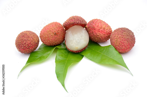 red ripe lychee with green leaves on white background