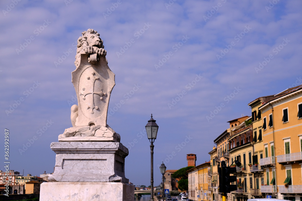Old buildings and statue in Pisa 