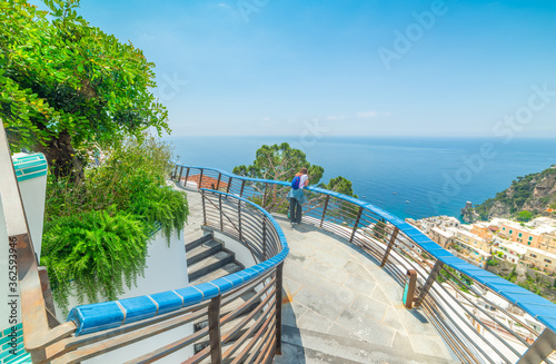Wallpaper Mural Tourist leaning on a balustrade in world famous Positano Torontodigital.ca