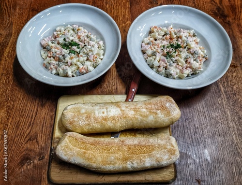 Russian maionese salad olivie and bread photo