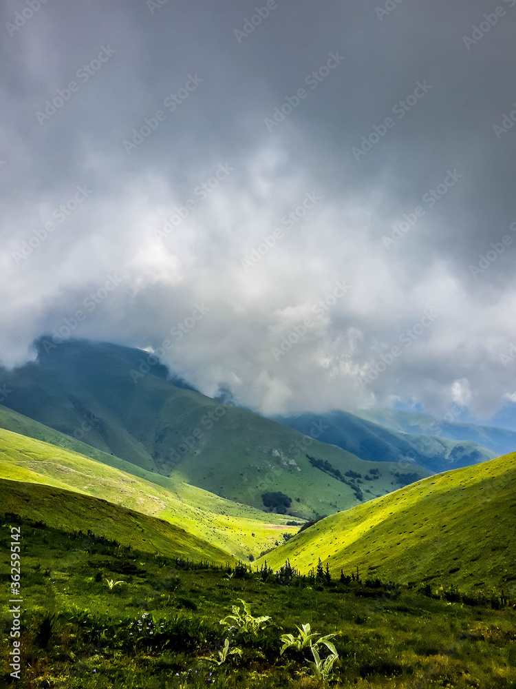 View from a top of the mountain on a cloudy day View from a top of the mountain on a cloudy day