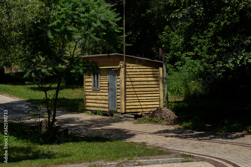 wooden house in the summer park photo