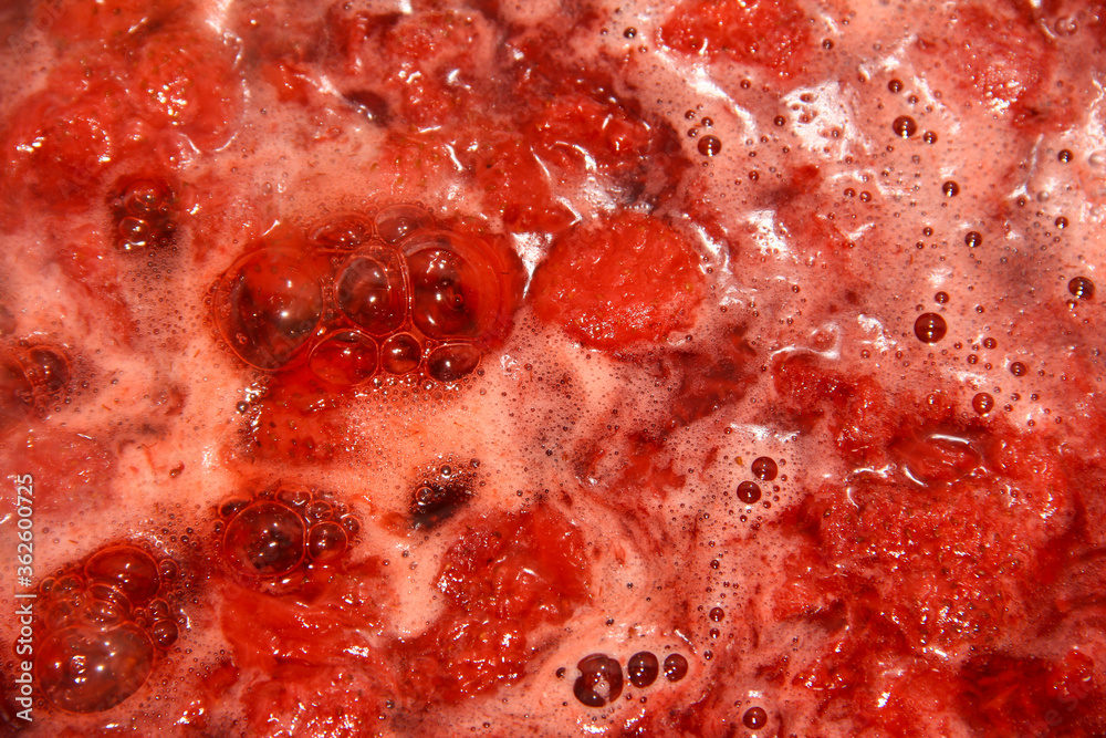 Strawberry jam is being made. A seething mass with berries. Strawberry jam is being made. A seething mass with berries.