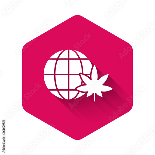White Legalize marijuana or cannabis globe symbol icon isolated with long shadow. Hemp symbol. Pink hexagon button. Vector Illustration.