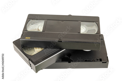 Black VHS video tape cassettes on white background