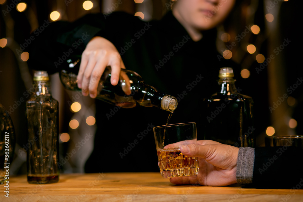 Barman pouring whiskey glass beautiful night Barman pouring whiskey glass beautiful night