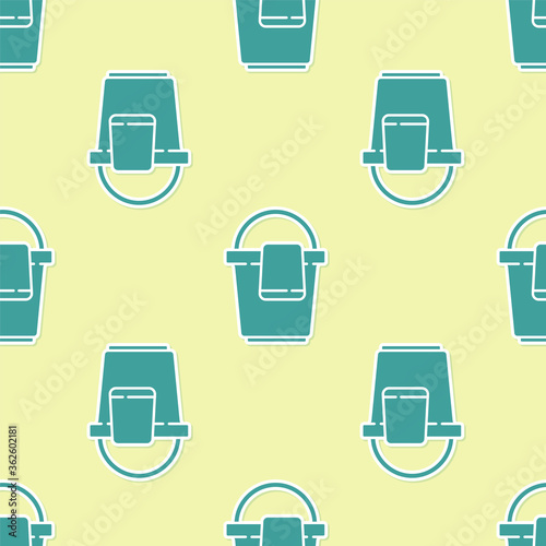 Green Bucket with rag icon isolated seamless pattern on yellow background. Cleaning service concept. Vector Illustration.
