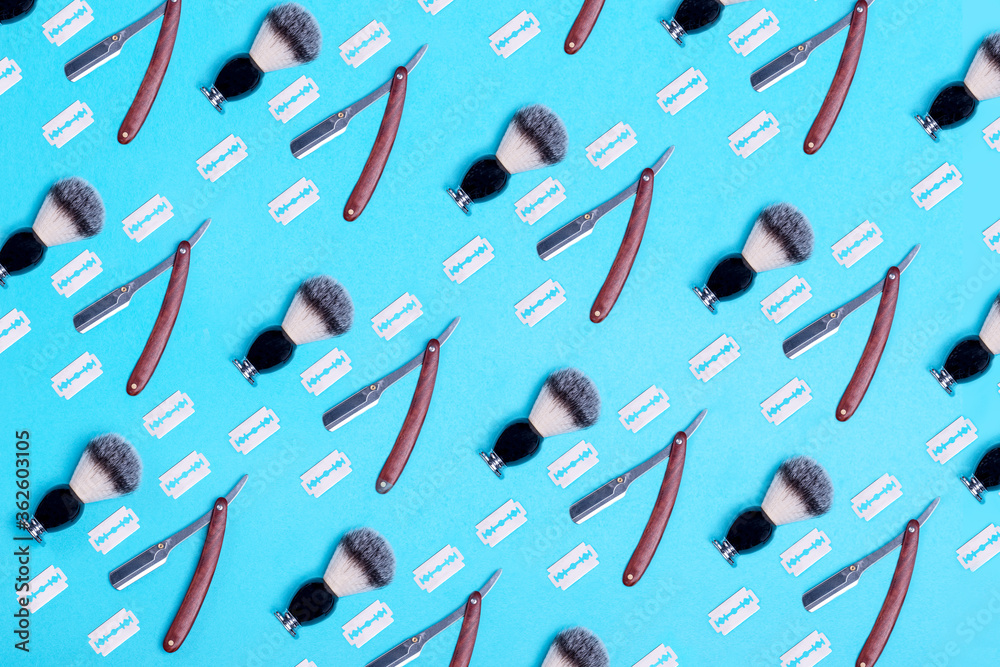 pattern of razors, brush and blade on blue background