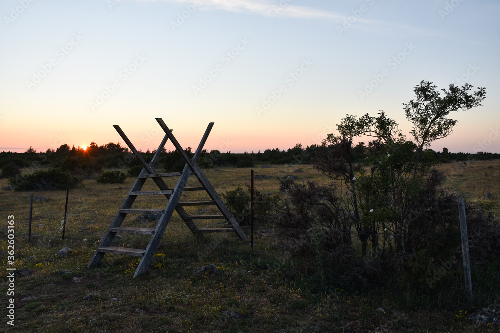 Traditional wooden stile by sunset Traditional wooden stile by sunset