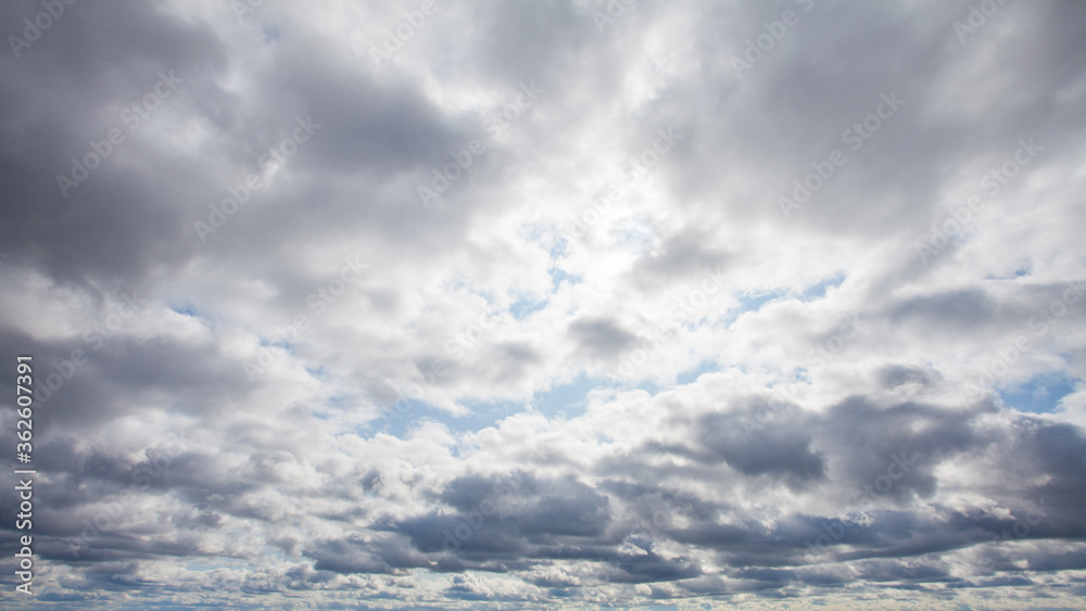 Fototapeta premium Storm clouds on the sky. Blue sky with white clouds