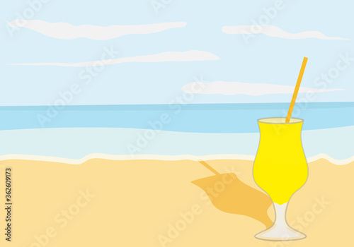 Playa con una copa de refresco de limón.