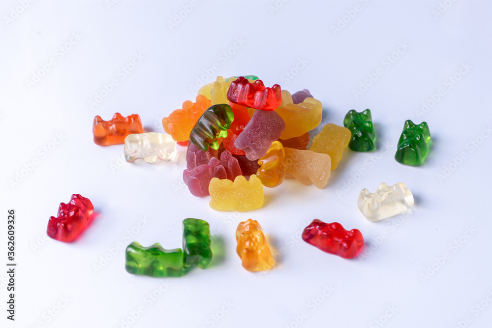 Pile of multicolored jelly bears candy on a white background. Pile of multicolored jelly bears candy on a white background.