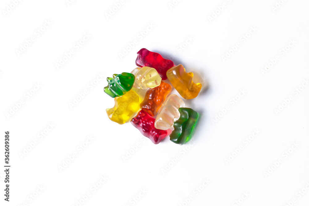 Pile of multicolored jelly bears candy on a white background. Pile of multicolored jelly bears candy on a white background.