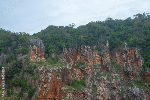 Rock mountain with green forest