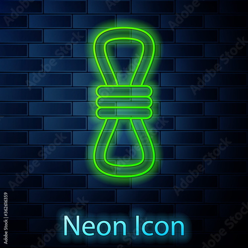 Glowing neon line Climber rope icon isolated on brick wall background. Extreme sport. Sport equipment. Vector Illustration.