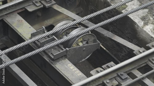 Cable car gear detail of wheel and cable in motion