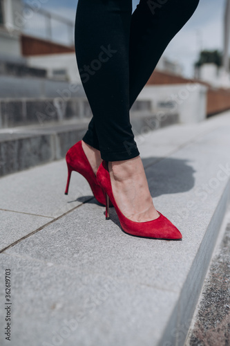 woman legs in red shoes
