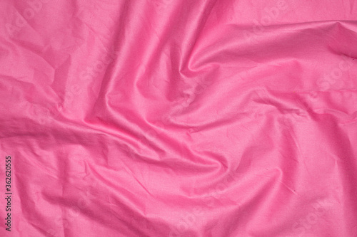 crinkled pink material texture or background.