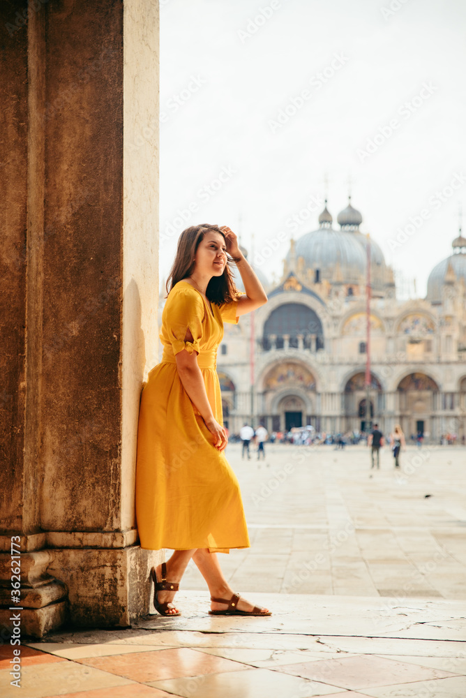 woman in yellow sundress at saint marco piazza