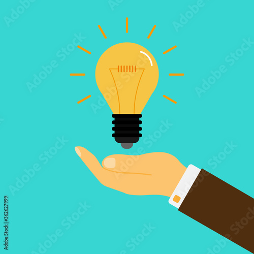Yellow luminous light bulb on a white background in a man's hand. Fresh thought, idea. Flat style