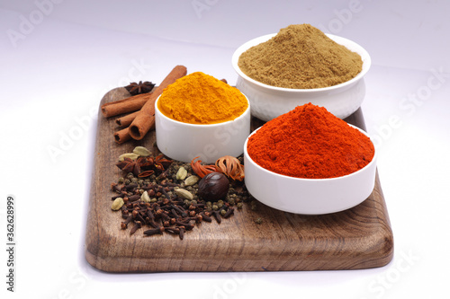 Spices with wooden background photo