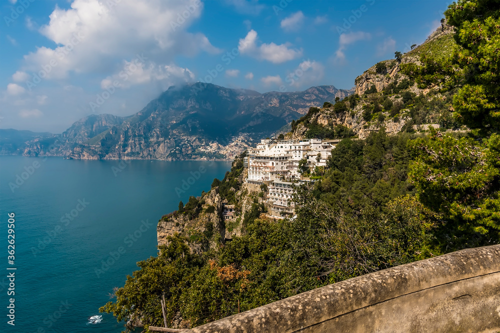 A view down the Amalfi coast with the village of Positano, Italy in the distance