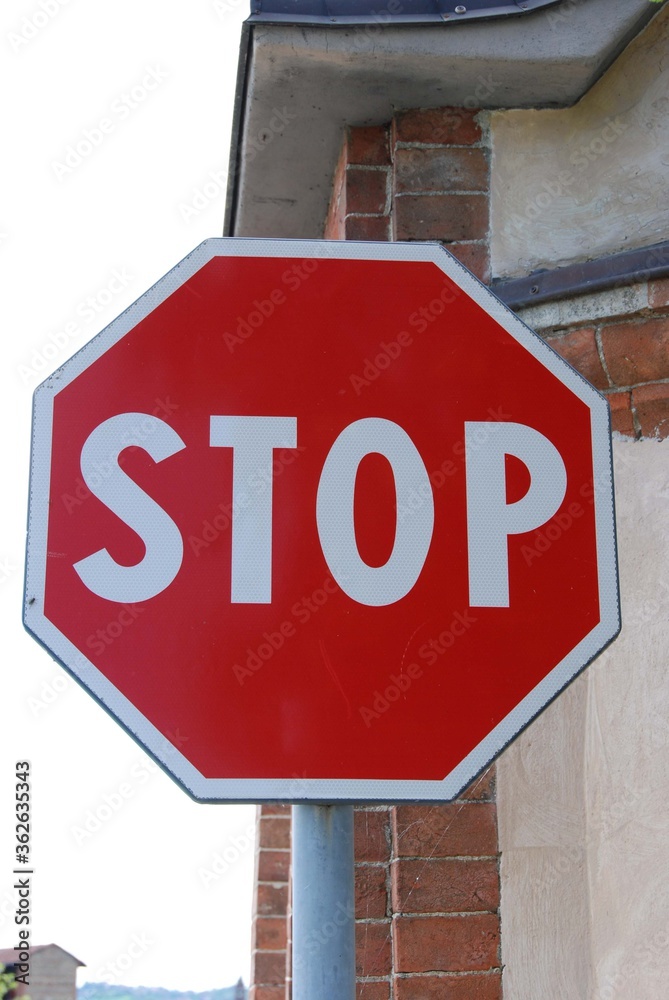 Road sign with stop sign