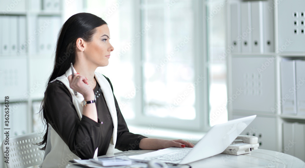 Portrait of businesswoman working in office Portrait of businesswoman working in office