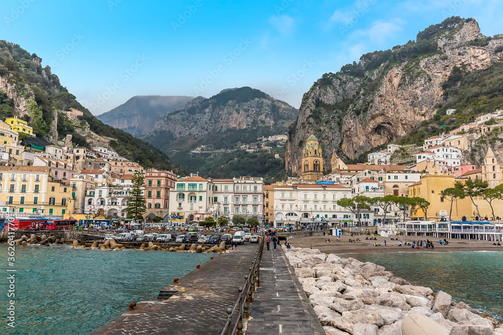 The pastel coloured town of Amalfi, Italy viewed from the pier