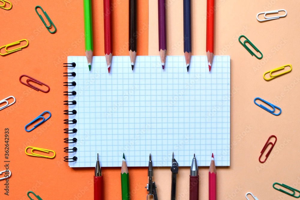 Flat composition of School stationery on a colorful background. The view from the top. Education Flat composition of School stationery on a colorful background. The view from the top. Education
