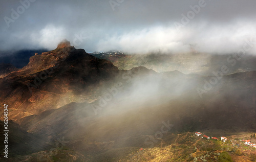 Stormy weather over Roque Bentayga, landmark of Gran Canaria, Canary islands, Spain