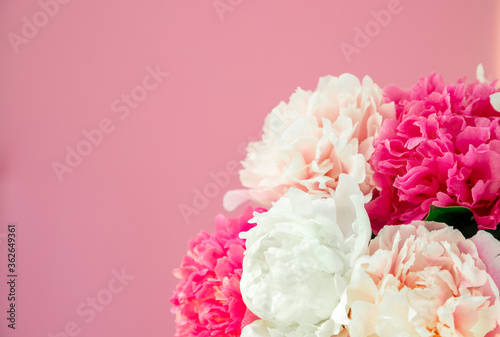 Bouquet beautiful flowers on pink background. Universal greeting card. FLatlay with pionies photo