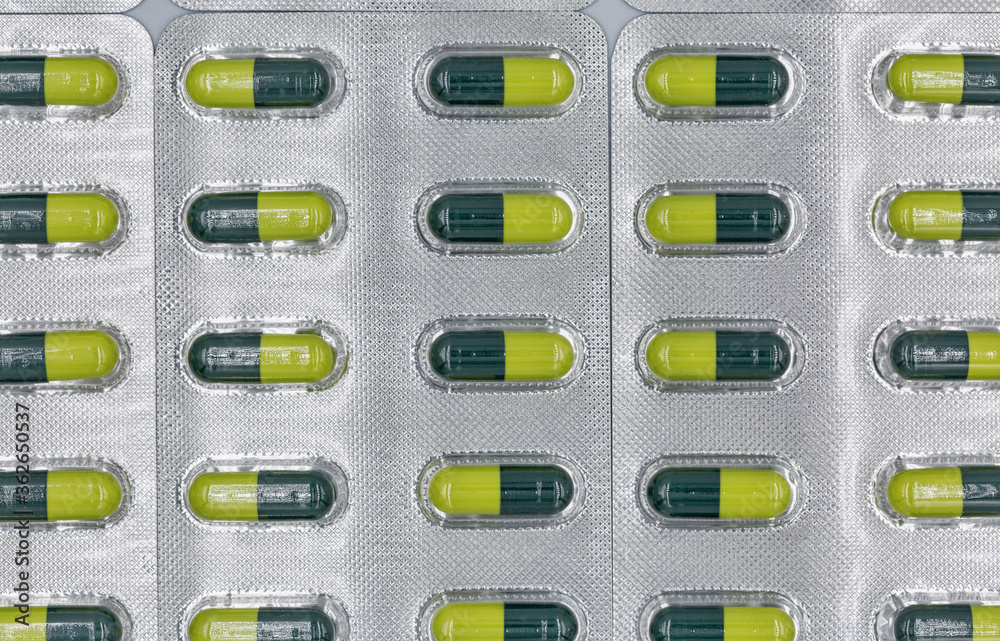 Medical capsules in blisters closeup background