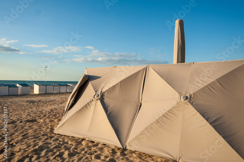 bath cabin and parasols on the beach of Ostend, Belgium