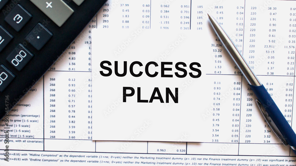 Work smarter text Success Plan on white sheet with pen, calculator and tables Work smarter text Success Plan on white sheet with pen, calculator and tables
