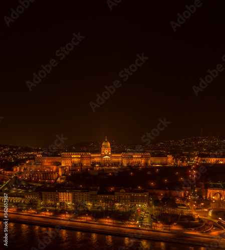 Aerial drone shot of Buda castle on Buda Hill in Budapest night with city lights on