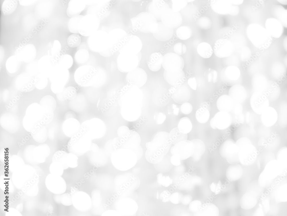 blurred bokeh light defocused background and textured for Christmas , New Year holidays party and celebration background, black and white colour