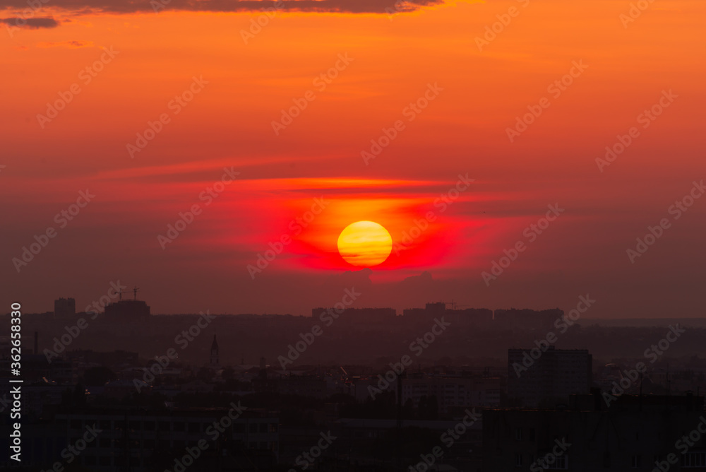 Beautiful orange sunset over the city of Ryazan in summer