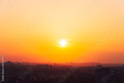 Beautiful orange sunset over the city of Ryazan in summer