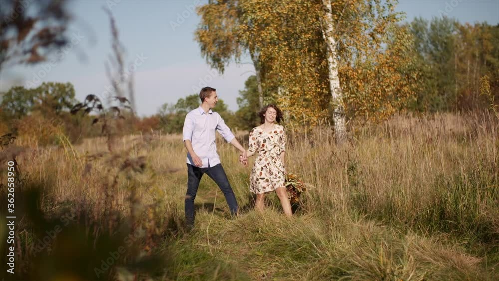 Couple in Love Walking and Holding Hands Couple in Love Walking and Holding Hands