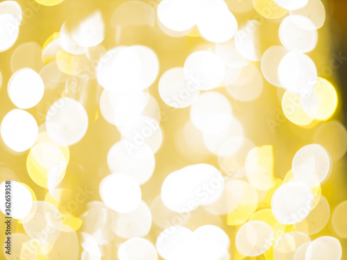 blurred bokeh light defocused background and textured for Christmas , New Year holidays party and celebration background, golden colour
