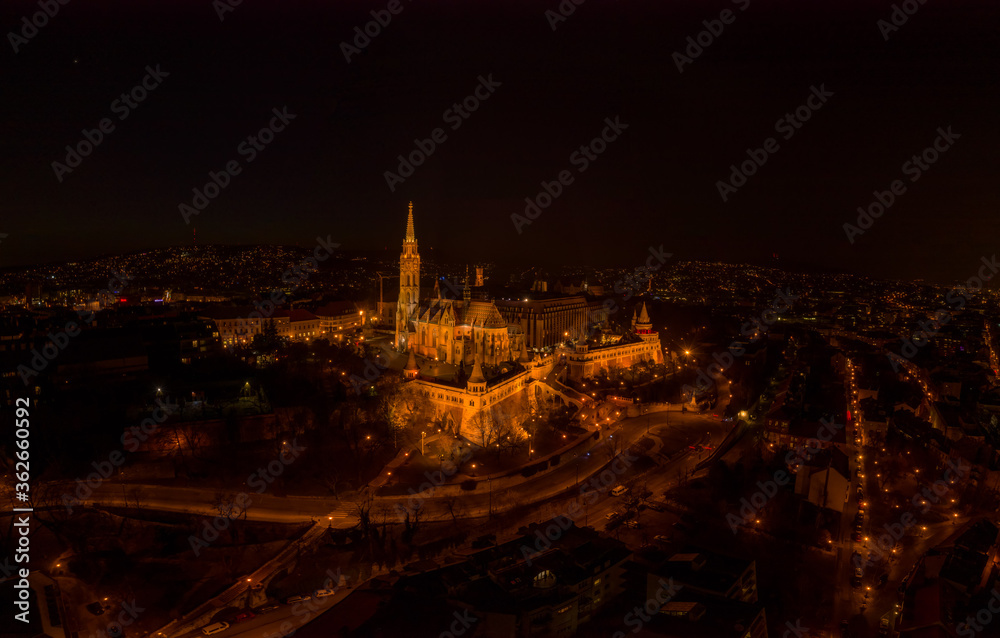 Aerial drone shot of Matthias Church on Buda hill on Fisherman Bastion in Budapest night