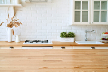 Kitchen wooden table top and kitchen blur background interior style scandinavian