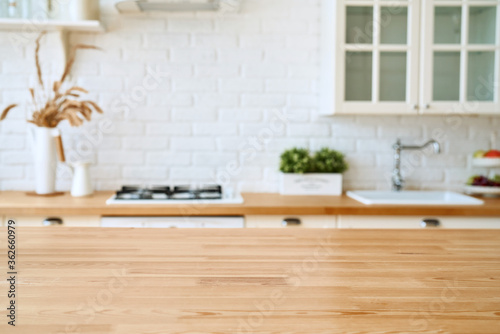 Kitchen wooden table top and kitchen blur background interior style scandinavian photo