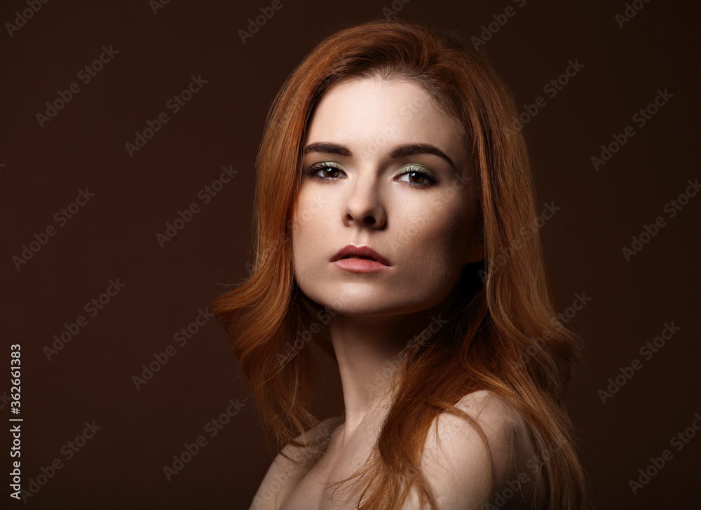 Beautiful natural makeup woman with red volume hair style. Closeup portrait